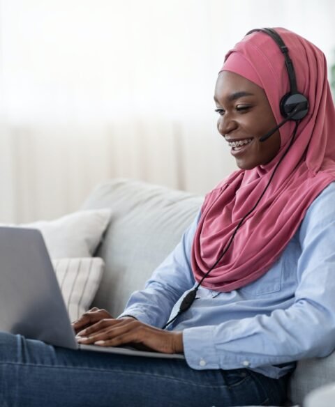 online-learning-african-islamic-woman-in-headset-stydying-at-home-with-laptop